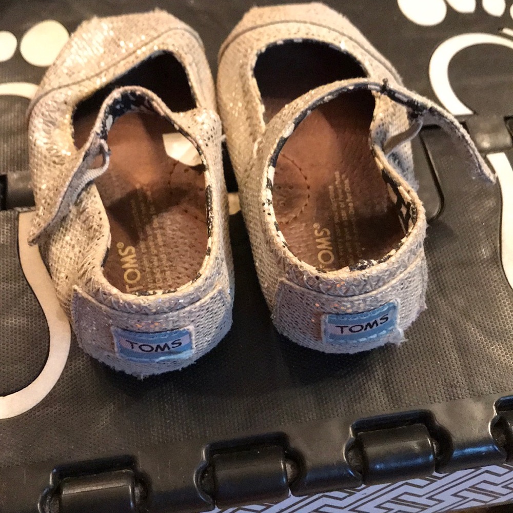 Tom’s Silver Shiny shoes. Signs of wear.
